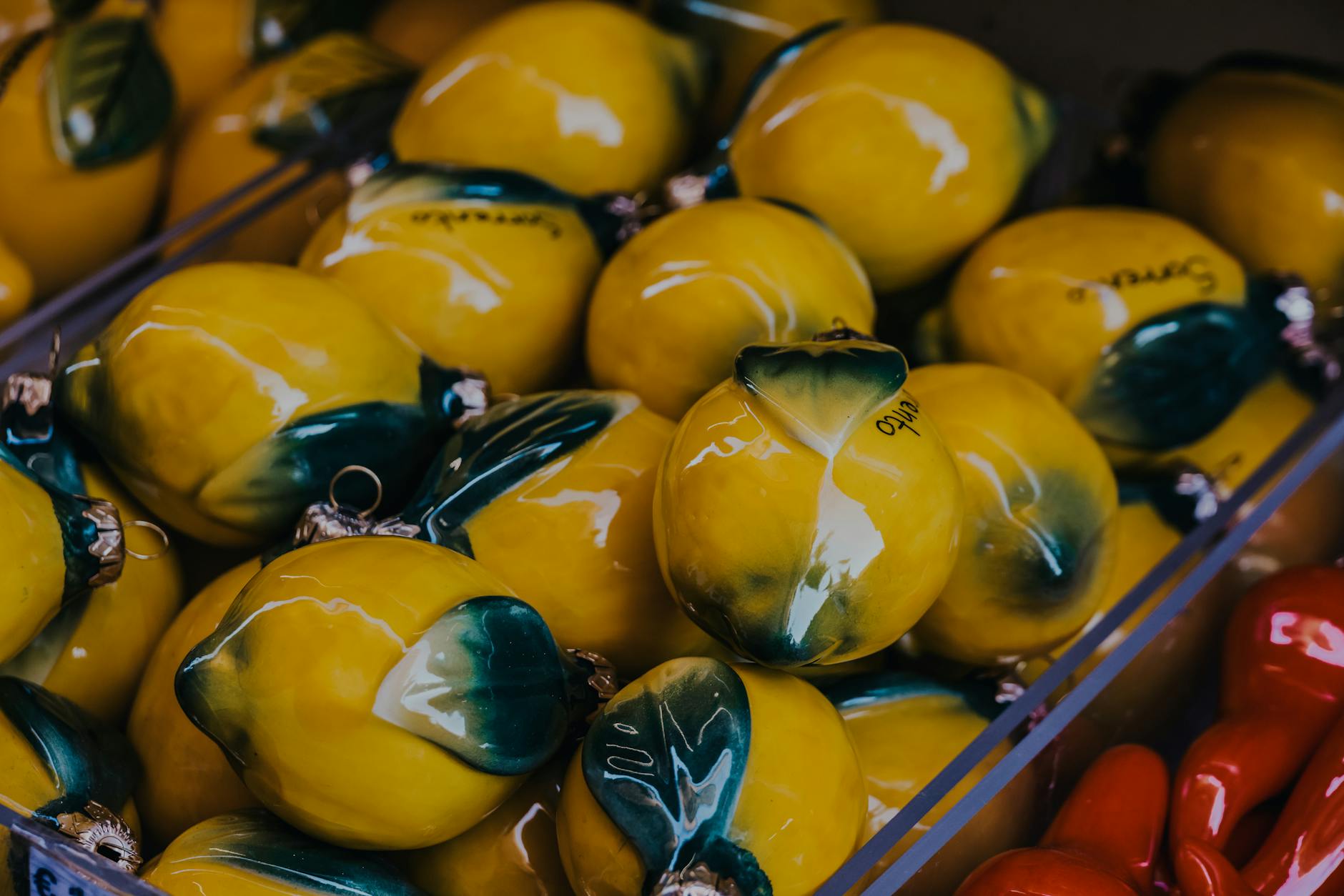 Vibrant yellow ceramic lemons artfully displayed, symbolizing the Lemon Clit vibrator brand